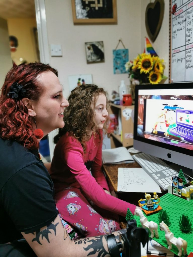 Mother and daughter trying the Build the Change Lego Challenge